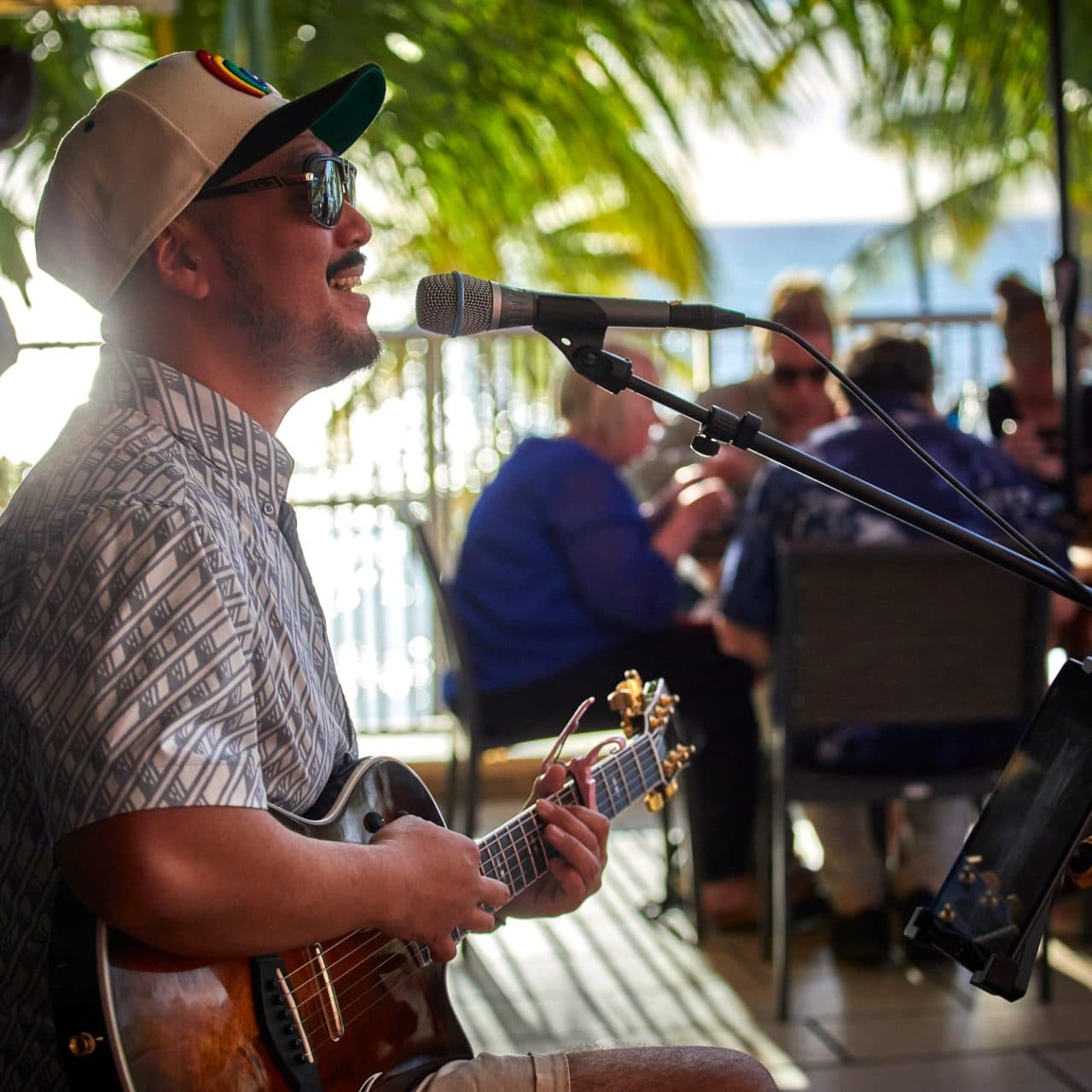A close-up of Tiki's Grill & Bar's Ahi Royale poke bowl, showing each ingredient, including fresh ahi, avocado, and Kahuku sea asparagus.
