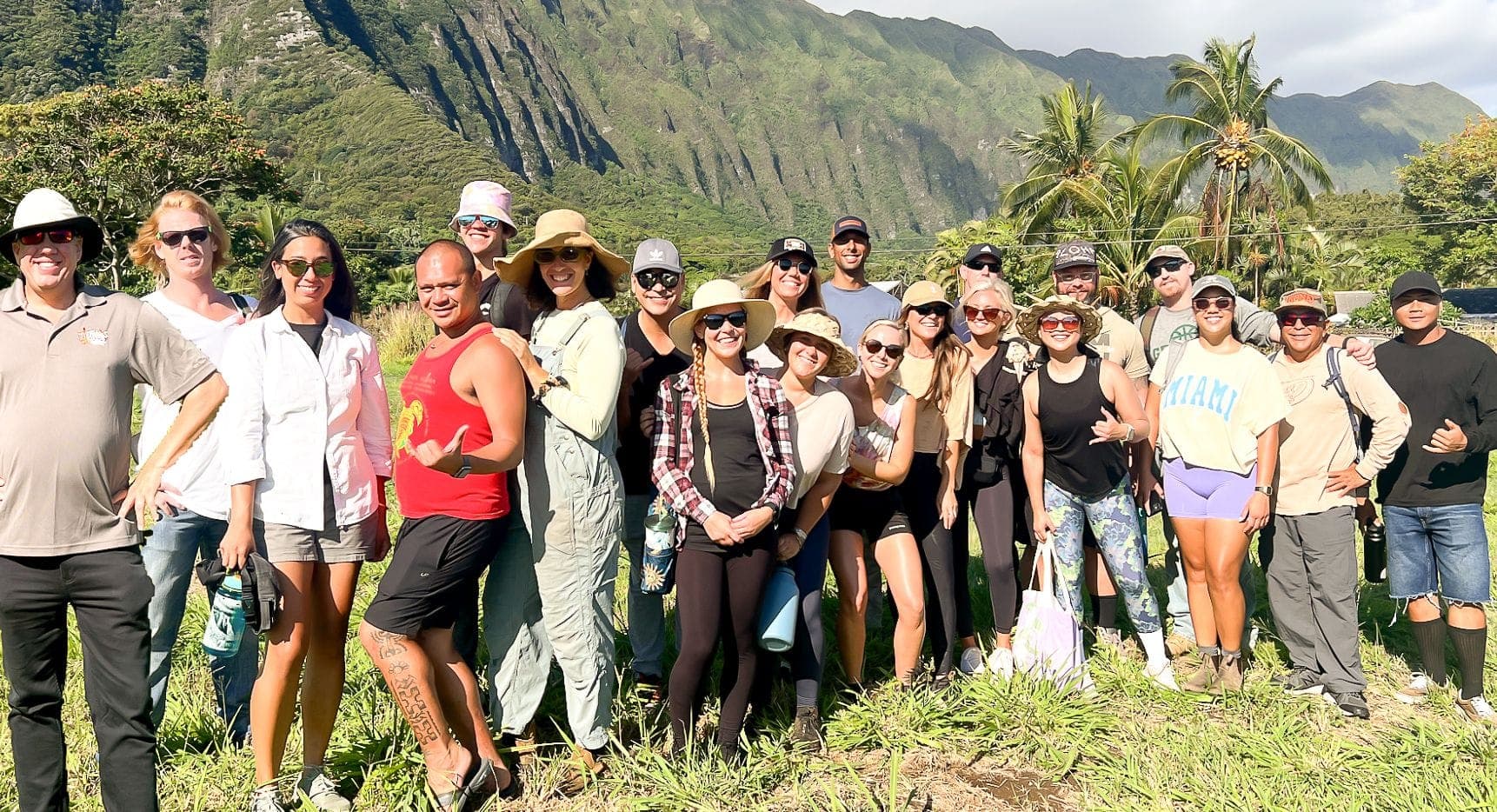 A group of Tiki's Grill & Bar volunteers working to clear a farm plot at Go Farm Hawaii in support of Aloha Harvest.
