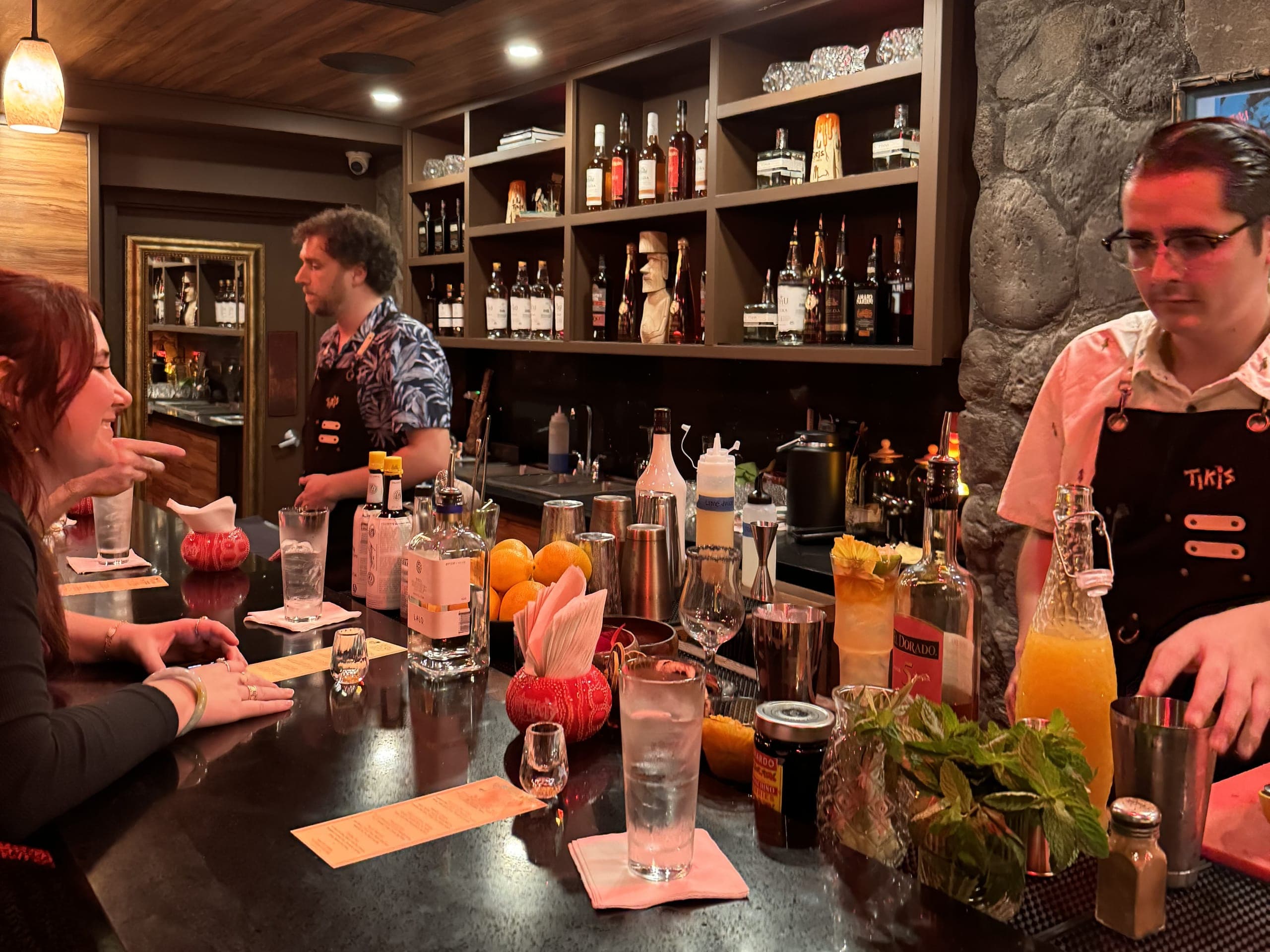 The Lava Lounge, an intimate 12-seat bar tucked inside Tikis Grill & Bar, showcasing a craft cocktail experience with expert bartenders.