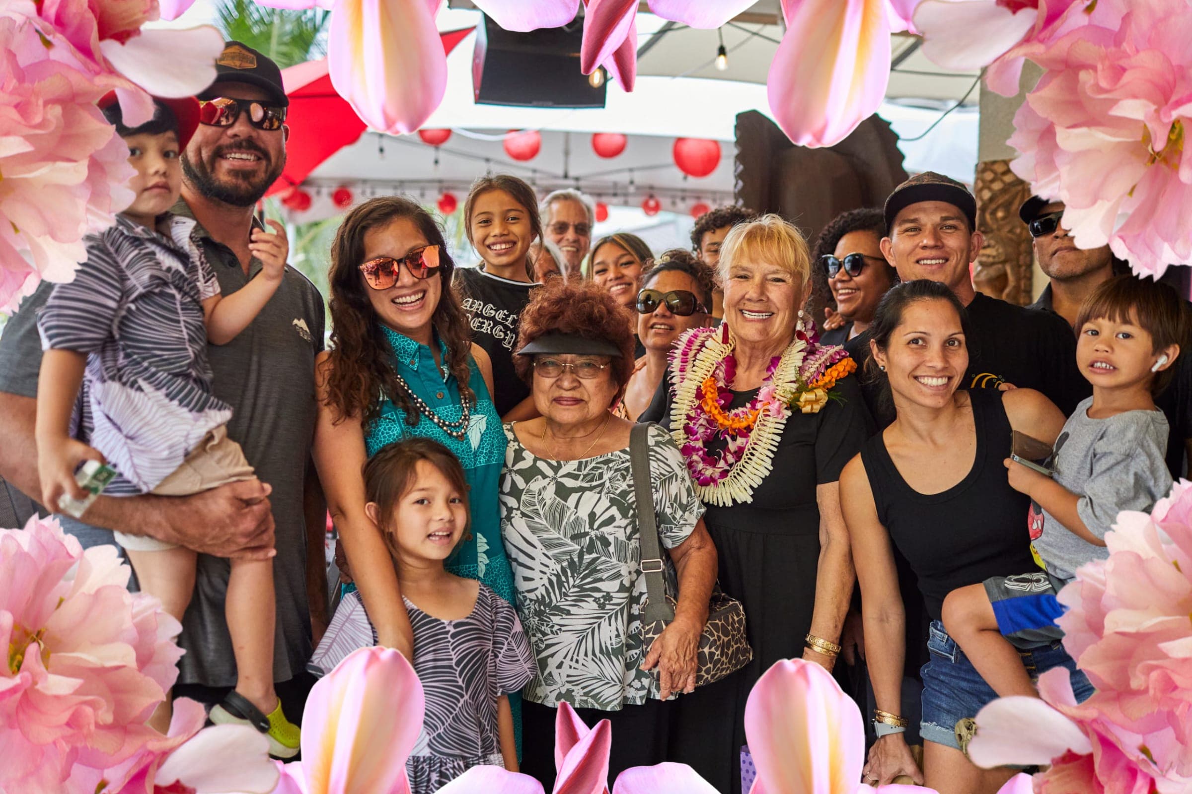 A multi-generational family celebrating Mother's Day at Tiki's Grill & Bar, showcasing a large group enjoying a special occasion at the best restaurant in Waikiki for families.