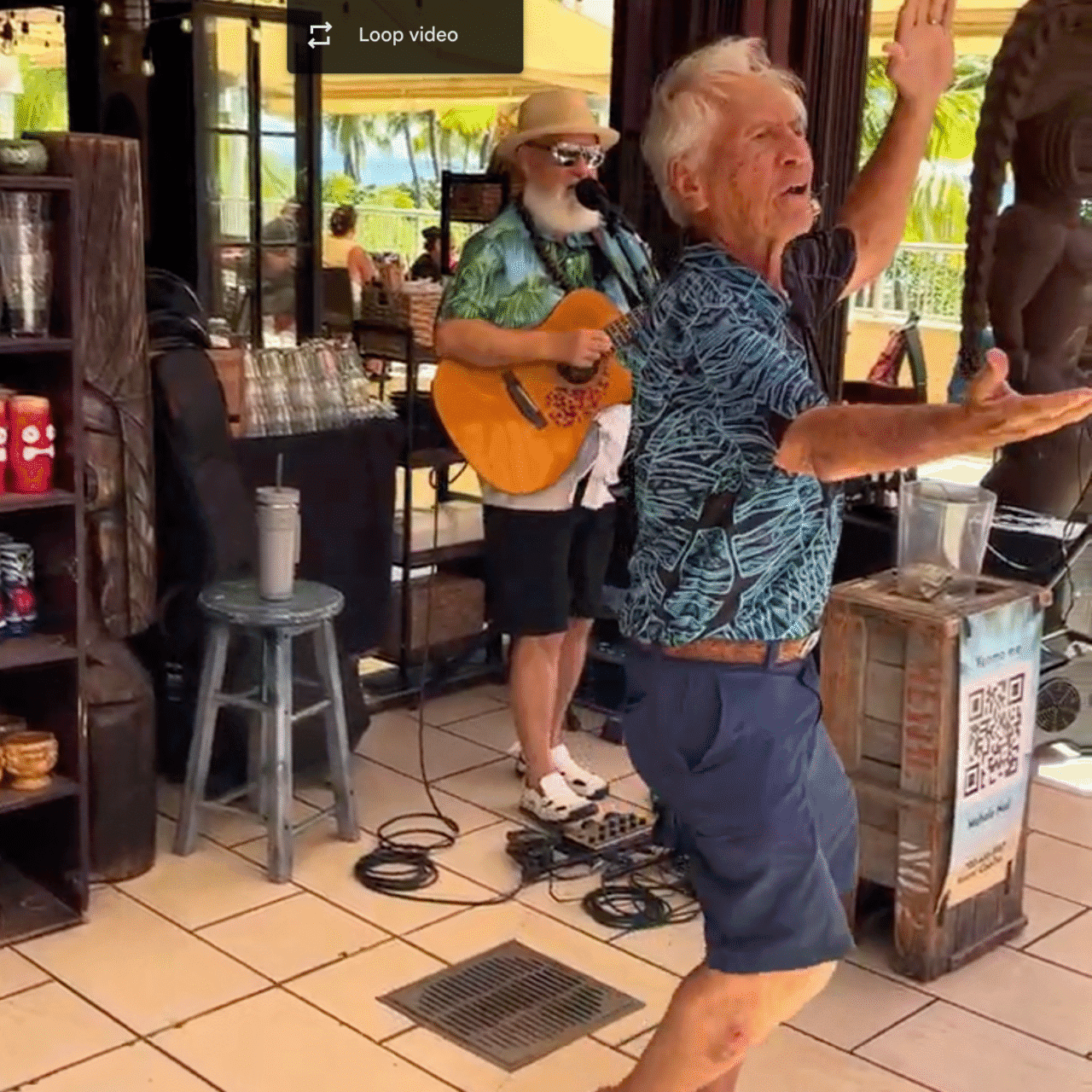 Kimo Kahoano performing a traditional Hawaiian hula at Tiki’s Grill & Bar in Waikīkī, bringing island culture to life.