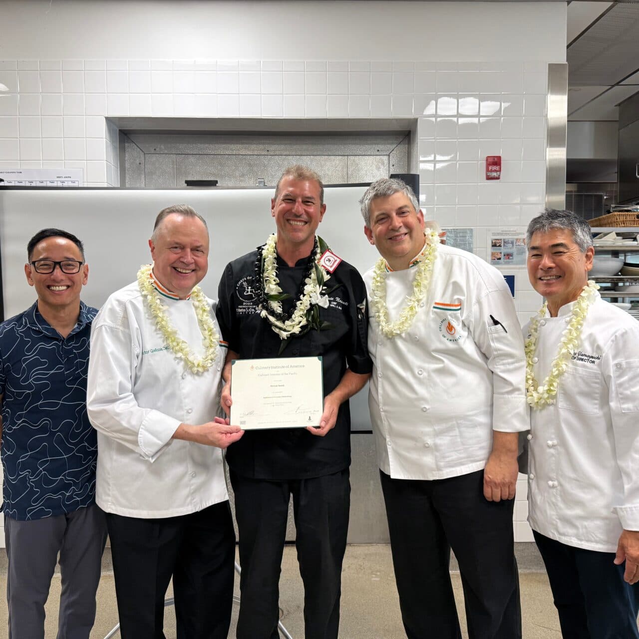 Chef Ronnie Nasuti receiving his Culinary Innovation certificate from the Culinary Institute of America and Culinary Institute of the Pacific at Diamond Head in 2025.